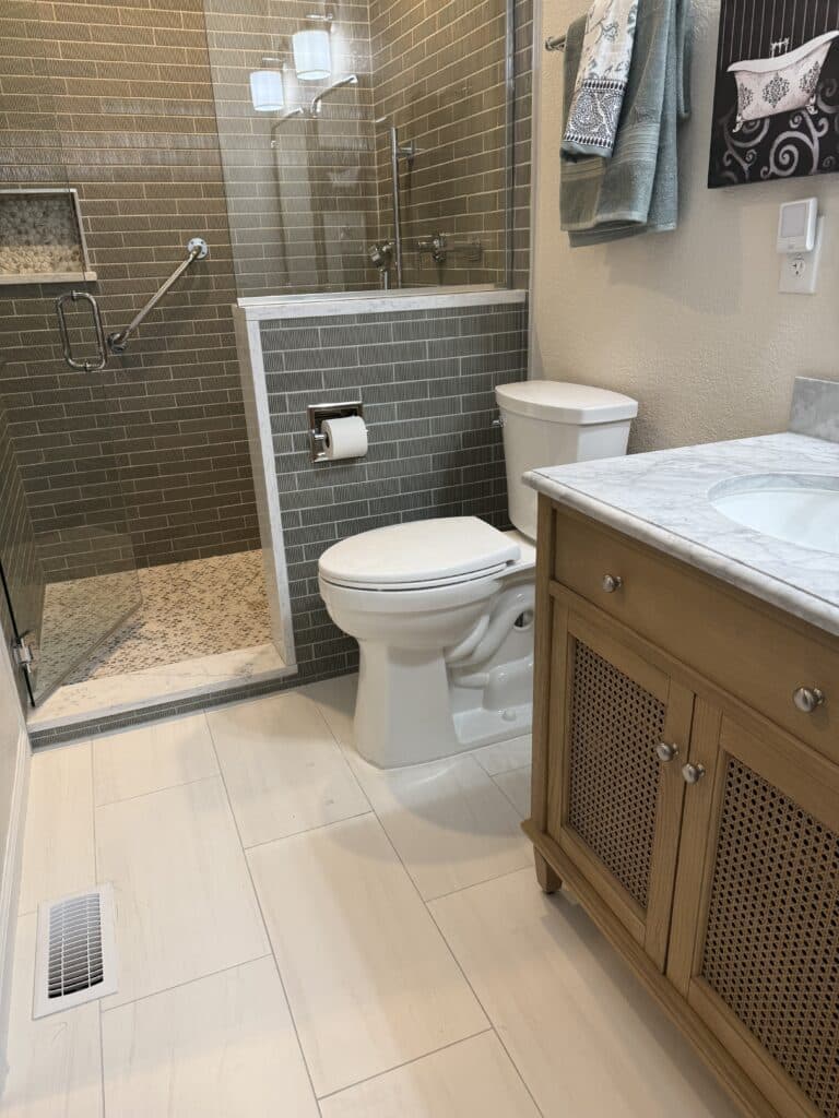 Bathroom remodel with green fluted tile